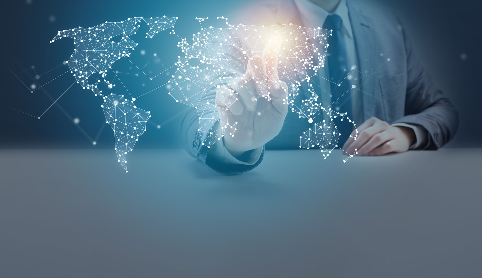 Businessman Pointing at Geometric Network Polygon World Map Hologram